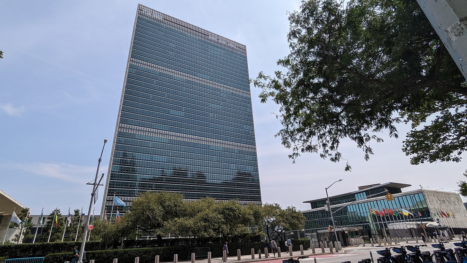 United Nations headquarters in New York, with the Secretariat tower and flags.